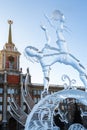 Yekaterinburg, Russia - January,13,2018: Icy sculpture of football player with ball on the Town Hall background. Royalty Free Stock Photo