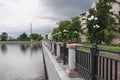 Yekaterinburg, Russia - June,21,2017: Embankment of the city pond with view of unfinished TV tower in summer day.