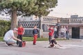 Boys are dancing breakdance on a city street. The soloist child standing on his head. Bystanders become spectators. Royalty Free Stock Photo