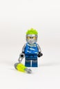 Toy hero Jay in a blue kimono with a kusarigama from a set of Lego ninjago on a white background. close-up