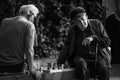 YEKATERINBURG, Sverdlovsk region, Russia-07.09.2020: two elderly men sit on the embankment and play chess