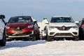 Yekaterinburg, Sverdlovsk Russia - 12 12 2020: A group of new Bright wet red and white cars with water drops and yellow sunset