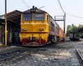 Yeliow train on tracks in phitsanulok, thaland. Royalty Free Stock Photo