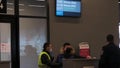 Yelizovo, Russia - February 11, 2021: Policeman stands near the passenger check-in counter