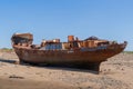 YELLAND, NORTH DEVON, UK - MAY 28 2020: Abandoned broken ship wreck, on sandy shore. Rusting hull on beach.