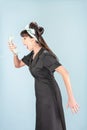 Yelling Retro Woman in Black Dress with Phone Receiver Royalty Free Stock Photo