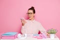 Yelling woman wearing eye glasses, screams to the phone, she is not happy and complains to her boss, sits at white Royalty Free Stock Photo