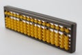 Yellow abacus Is plastic placed on a white background