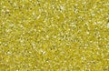 Yellow abstract background. Gold glitter closeup photo. Golden shimmer wrapping paper. Royalty Free Stock Photo