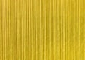 Yellow abstract striped pattern wallpaper background, gold paper texture with vertical lines Royalty Free Stock Photo