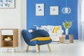 Yellow accents in blue room