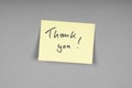 yellow adhesive note with handwritten thank you message Royalty Free Stock Photo