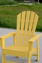 Yellow Adirondack chair at the beach Royalty Free Stock Photo