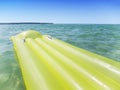 Yellow airbed in the sea Royalty Free Stock Photo