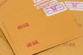 Yellow airmail envelopes with postmarks and postage stamps