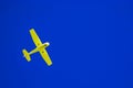 Yellow airplane and blue sky Royalty Free Stock Photo