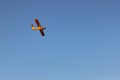 Yellow airplane in blue sky Royalty Free Stock Photo