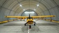 Yellow airplane glider in the hangar. Royalty Free Stock Photo