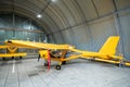 Yellow airplane glider in the hangar. Royalty Free Stock Photo