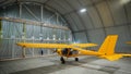 Yellow airplane glider in the hangar. Royalty Free Stock Photo