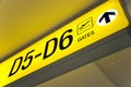 Yellow airport direction departure sign Royalty Free Stock Photo