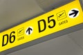 Yellow airport direction departure sign Royalty Free Stock Photo