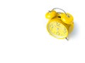 Yellow alarm Clock analog classic retro style on white backgroun