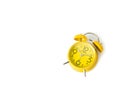 Yellow alarm Clock analog classic retro style on white backgroun