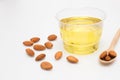 Yellow almond oil in a clear bowl