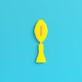 Yellow american football ball throphy on bright blue background in pastel colors