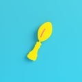 Yellow american football ball throphy on bright blue background in pastel colors