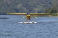 Yellow amphibious seaplane on Lake Casitas, Ojai, California