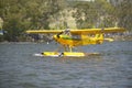 Yellow amphibious seaplane taking off from Lake Casitas, Ojai, California