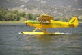 Yellow amphibious seaplane taking off from Lake Casitas, Ojai, California