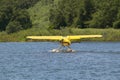 Yellow amphibious seaplane taking off from Lake Casitas, Ojai, California