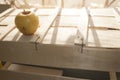 Yellow apple on an old box