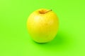 Yellow Apple on a green background close-up.isolate