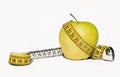 Yellow apple and measurement tape