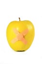 Yellow apple with strapping tape isolated Royalty Free Stock Photo