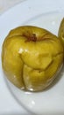 yellow apples baked in the microwave, diet food on a plate