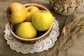 Yellow apples and ceramic foodware Royalty Free Stock Photo