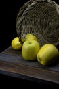 Yellow apples and lemons on wooden table Royalty Free Stock Photo