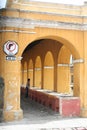 Yellow Archways frame outdoor laundry in Antigua Guatemala