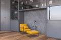 Yellow armchair in gray office waiting room Royalty Free Stock Photo