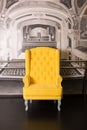 Yellow armchair in a studio