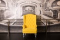 Yellow armchair in a studio