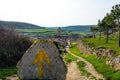 THE YELLOW ARROW - The french Way of `Camino de Santiago` in Winter. Pilgrimages on their journey through Spain Royalty Free Stock Photo