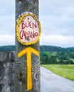 Yellow arrow, sign for pilgrims on the Camino de Santiago in Spa