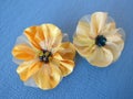 Yellow artificial fabric flowers