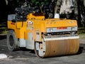 Yellow Asphalt Compactor or Road roller is ready to works for territory improvement.